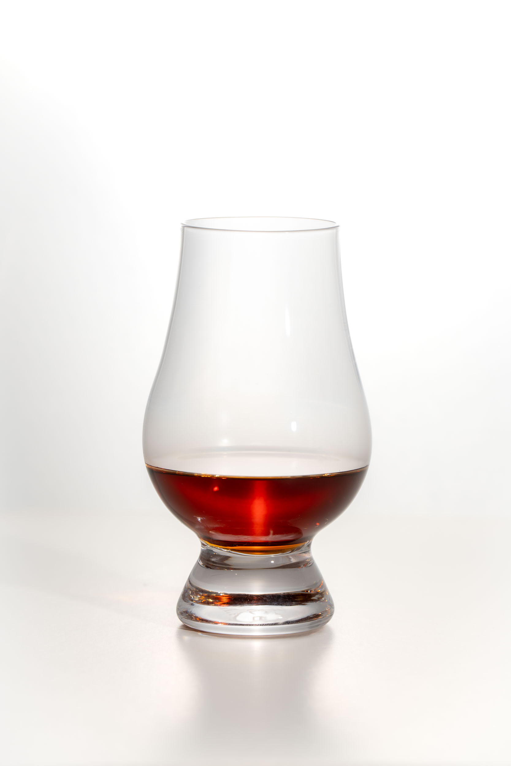 Auchentoshan Three Wood dram, a deep mahogany colour