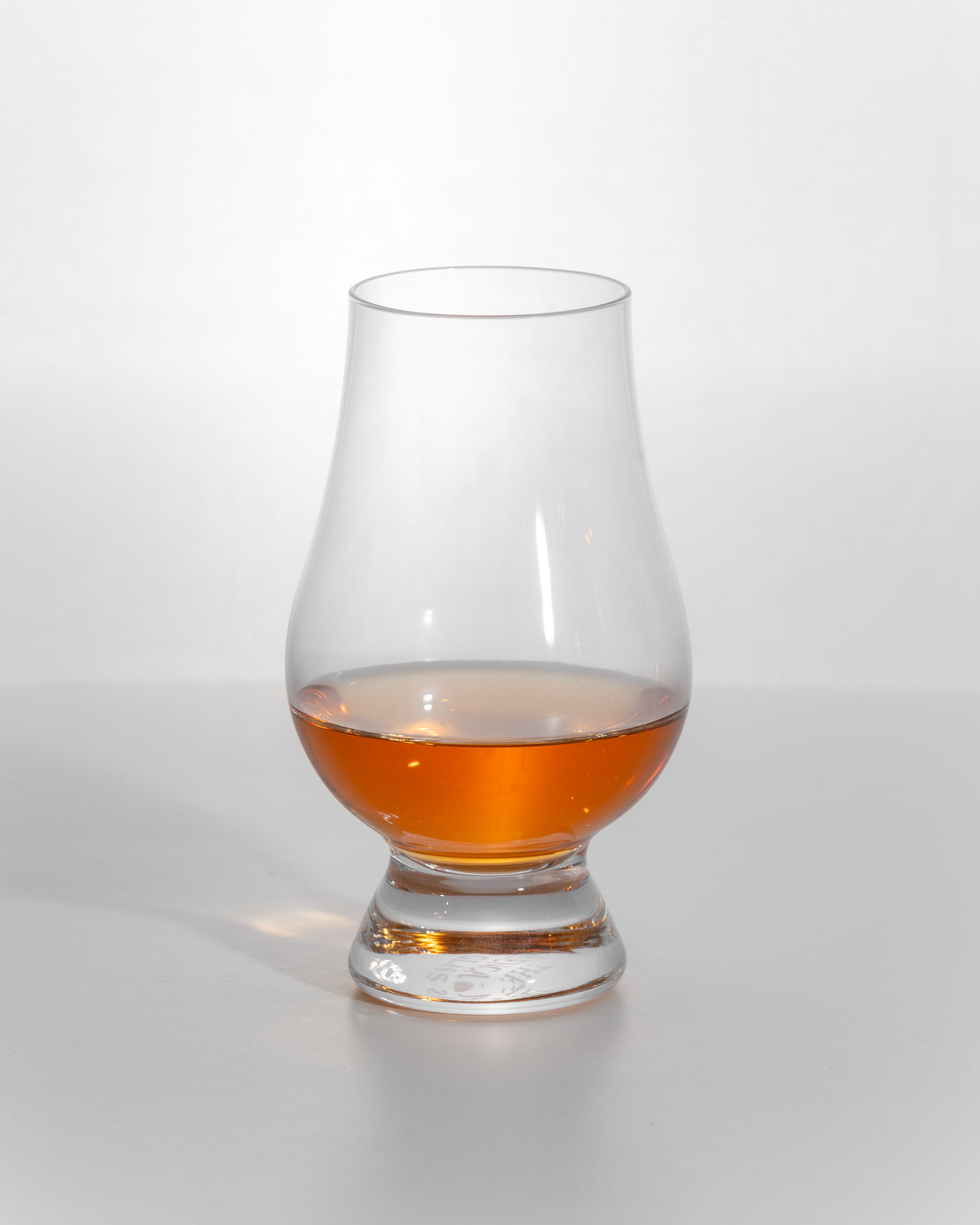 Ledaig Sinclair Series Rioja Cask dram, a reddish amber colour