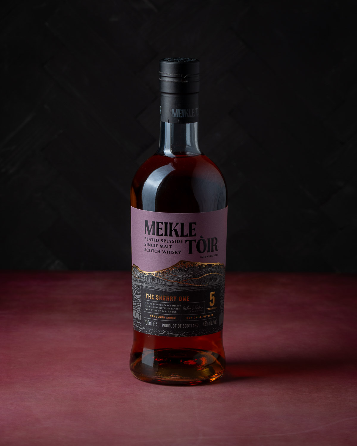 Meikle Tòir The Sherry One bottle against a dark panelled background