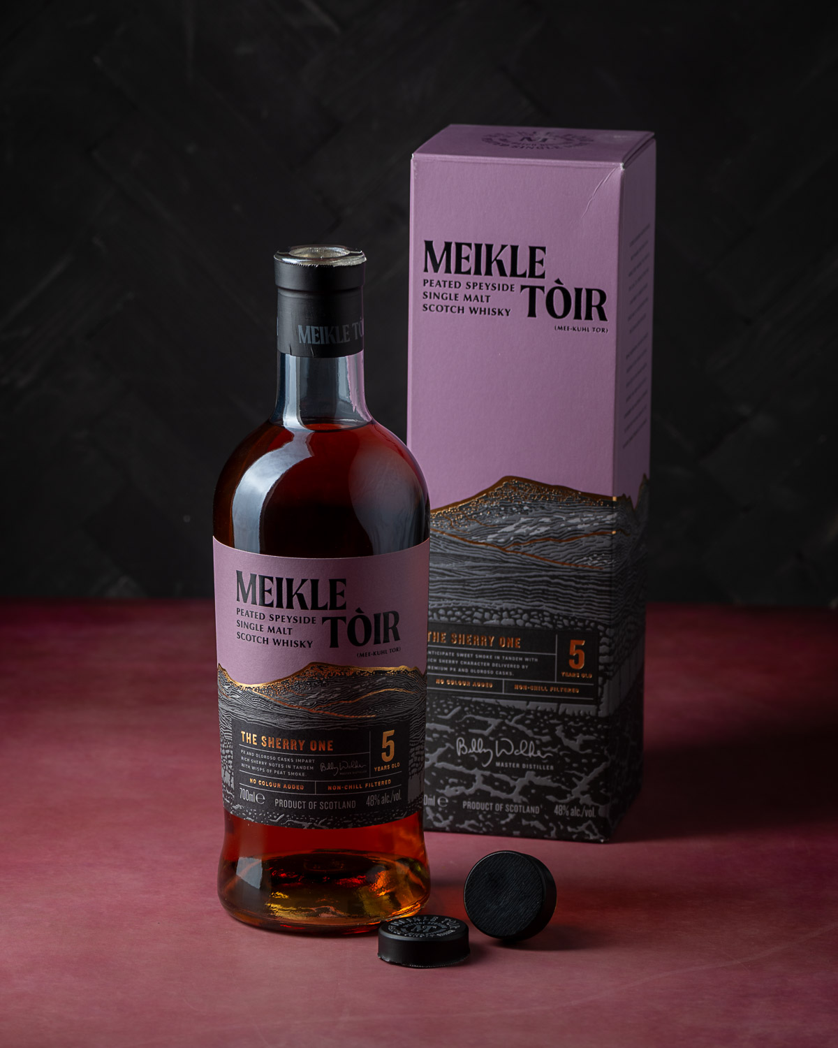 The bottle stood beside its packaging box with the cap removed